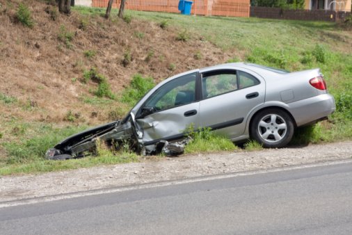 A Car has rolled off a Chicago road after having a Rear End Accident.