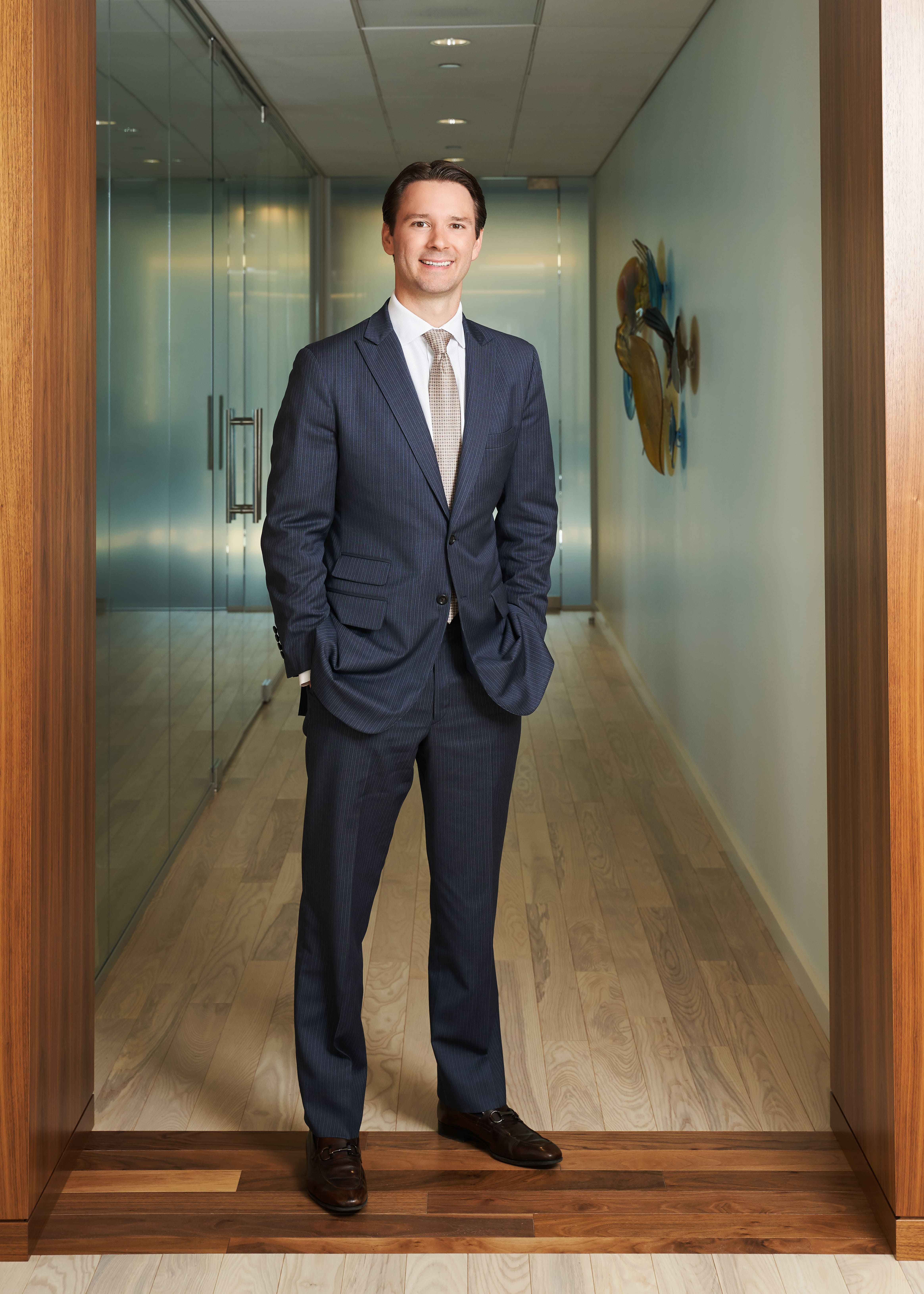 Patrick A. Salvi II standing in hallway of the Chicago office