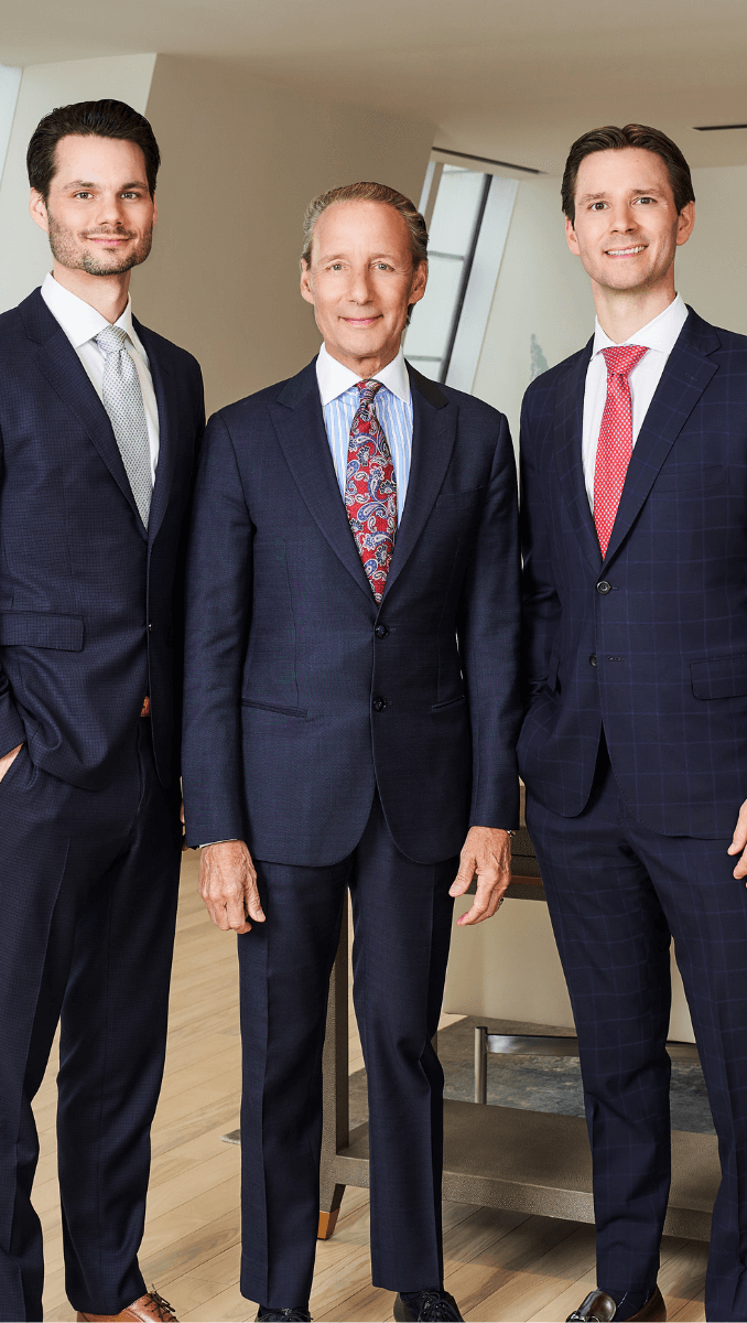 Brian, Patrick Sr., and Patrick A. Salvi II standing together in their Chicago office.
