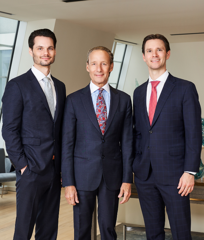 Brian, Patrick Sr., and Patrick A. Salvi II standing together in their Chicago office.